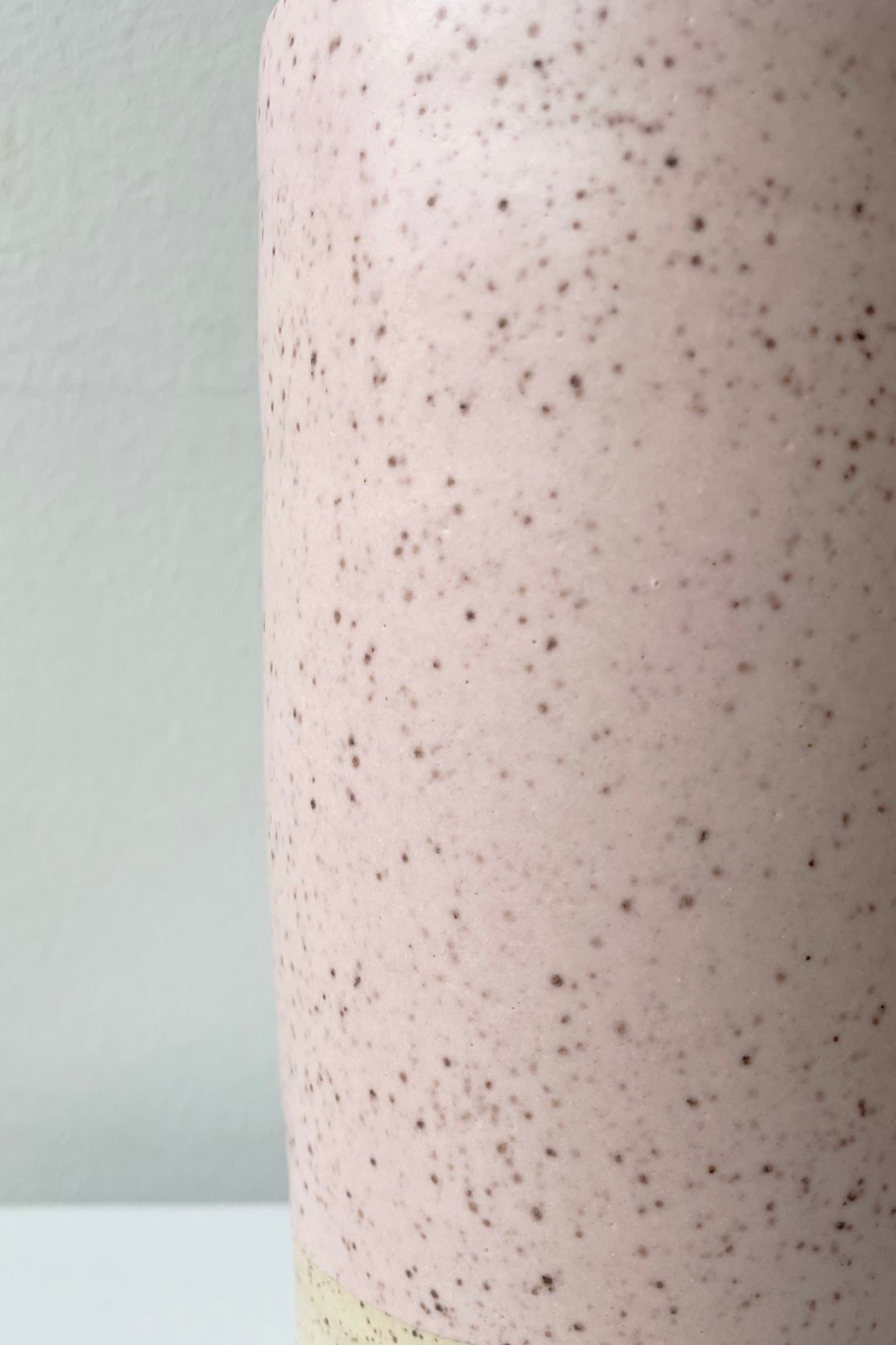 Detail of the glaze finish of the Pink Speckle Jacqueline vase. ©Sprout Home