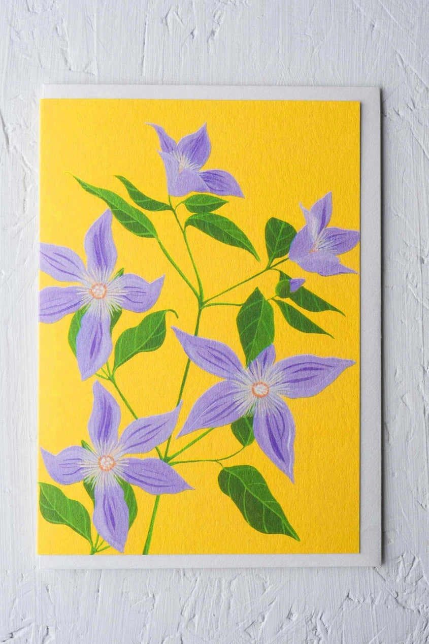 Sugar sweet Clematis card by Stengun Drawings with its purple flowers on bright yellow.