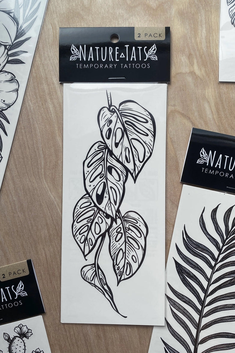 Nature and Tats temporary tattoos with leaf designs on a wooden surface ©Nature Tats