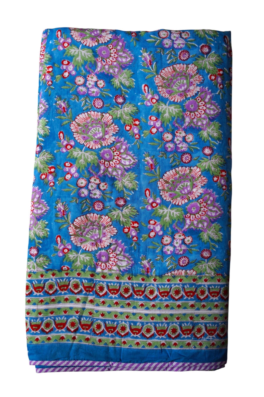 Colorful blue fabric with floral and geometric patterns of a reversible blanket ©Annahmol