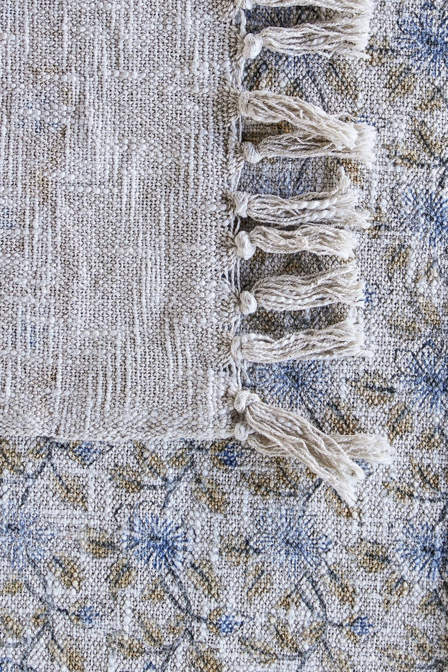 Textured fabric with tassels and a floral pattern ©Blue Ocean Traders