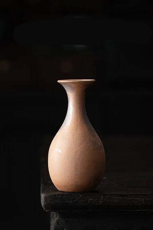 Jade unglazed vase on a black background ©Haku