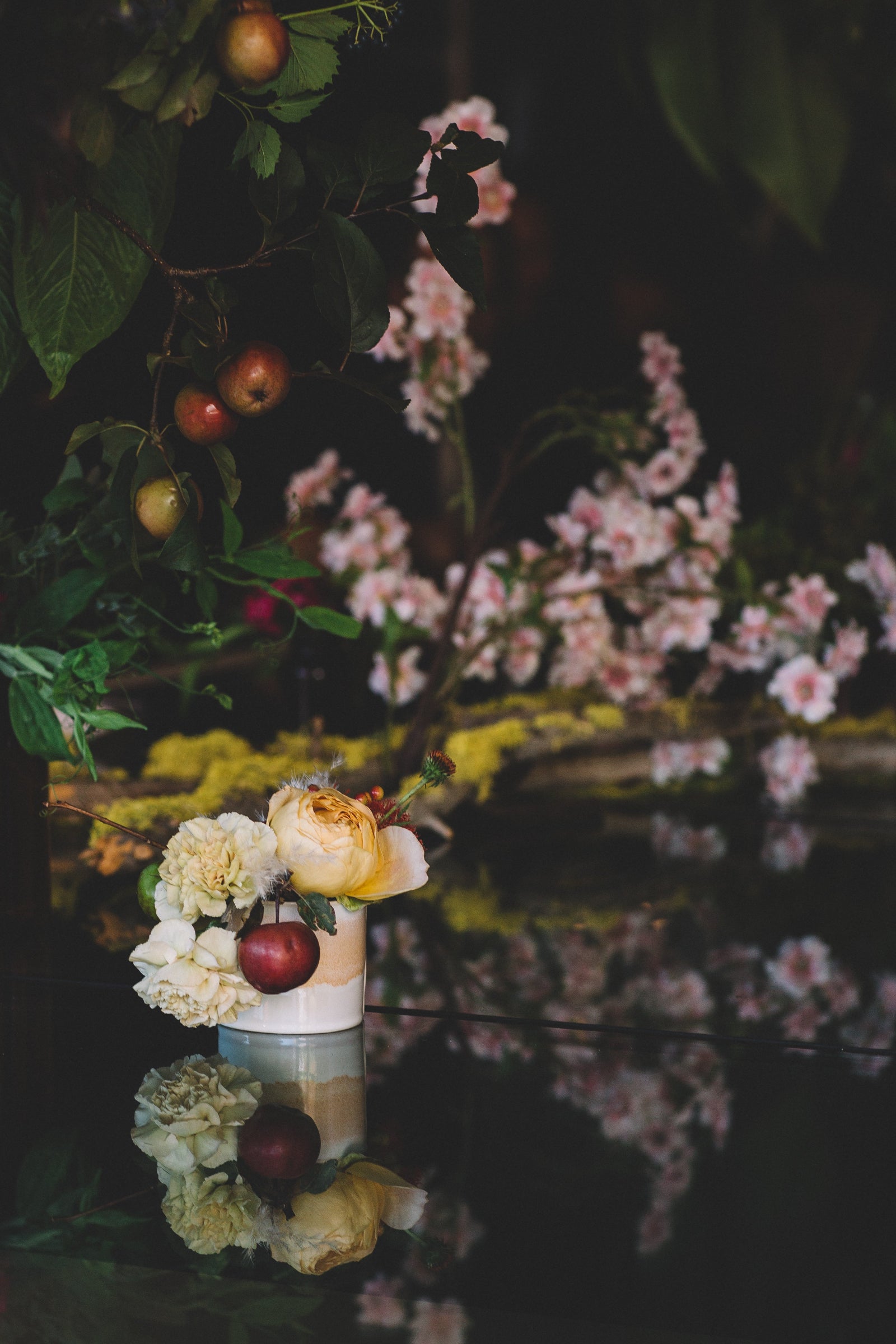 Sprout Home Floral small arrangement with floral branch backdrop. Photographed by Stephanie Bassos