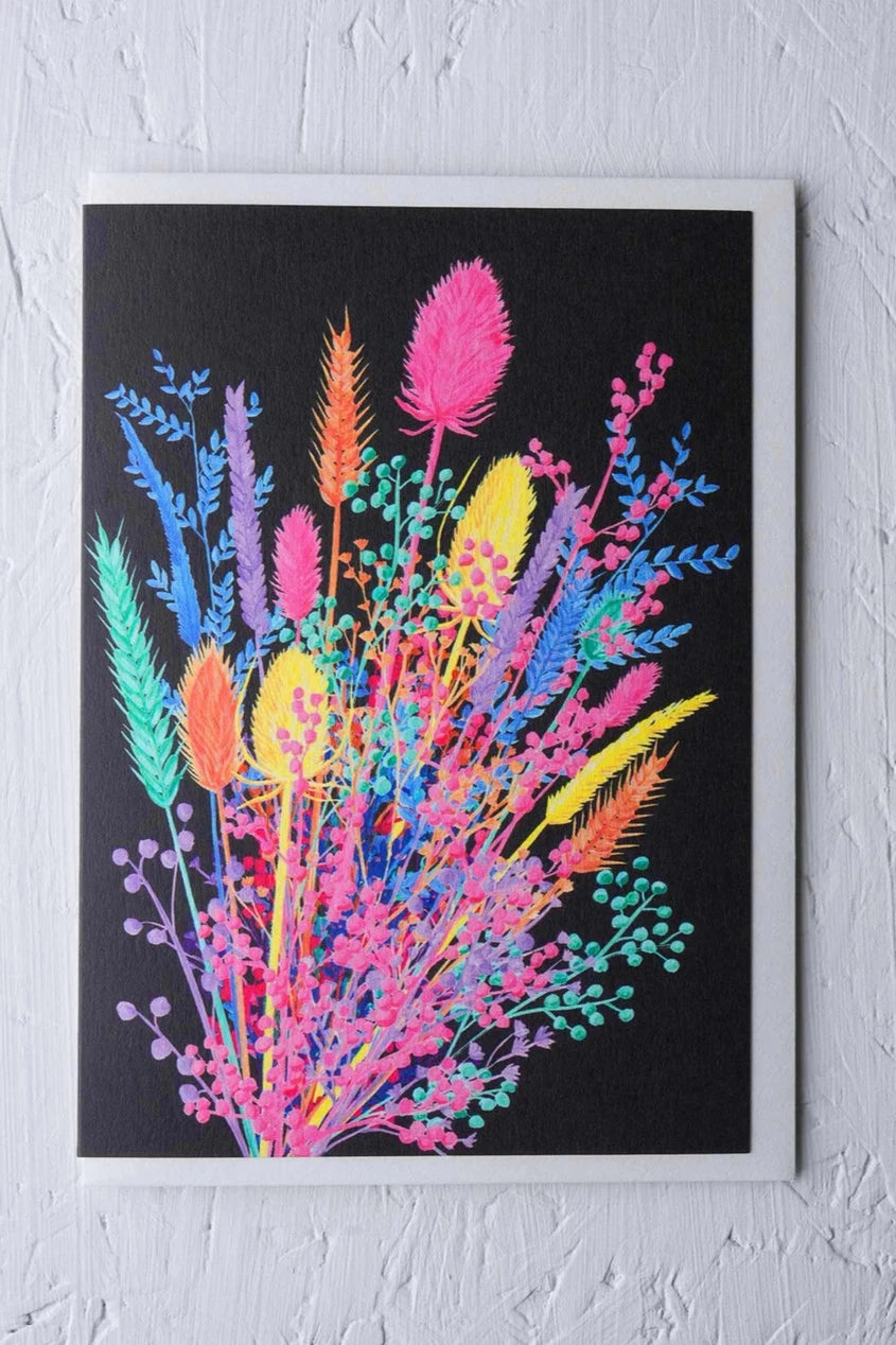 Dried Posy card by Stengun Drawings with its bright colors against a white wall.
