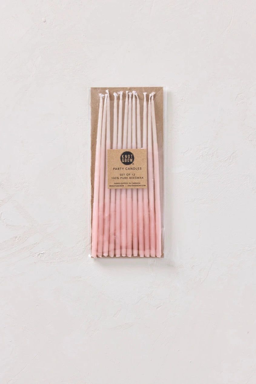 Knot & Bow Tall Ombre Pink beeswax candles in its packaging.