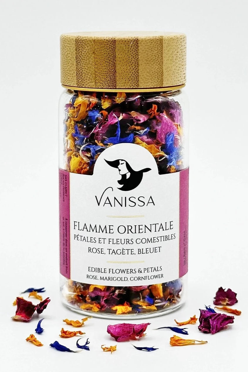Vanissa Flamme Orientale edible flowers in its packaging and loose petals in front of it.