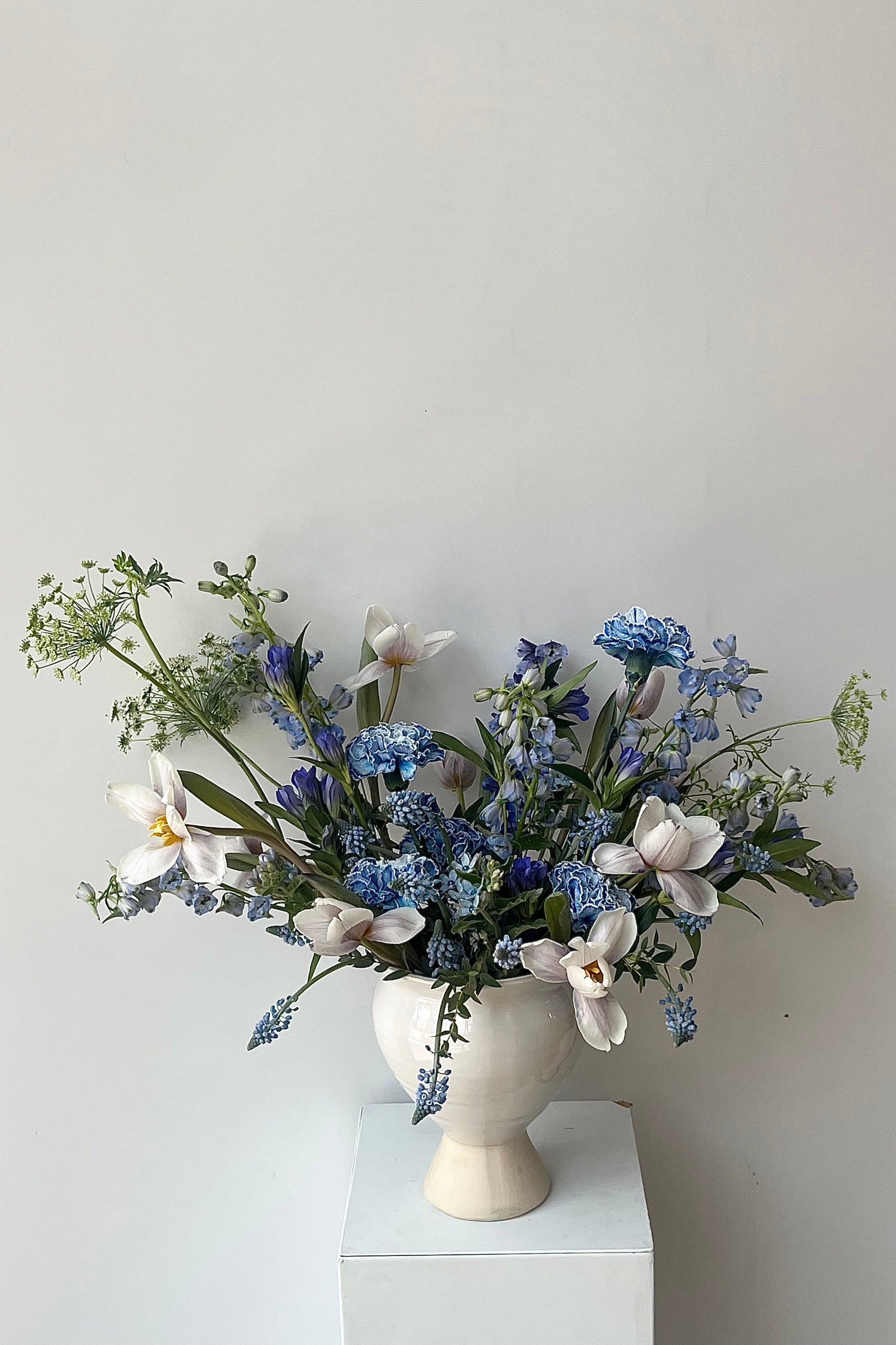BlueValentine arrangement in a white compote with dyed blue carnations ©Sprout Home #size_$200