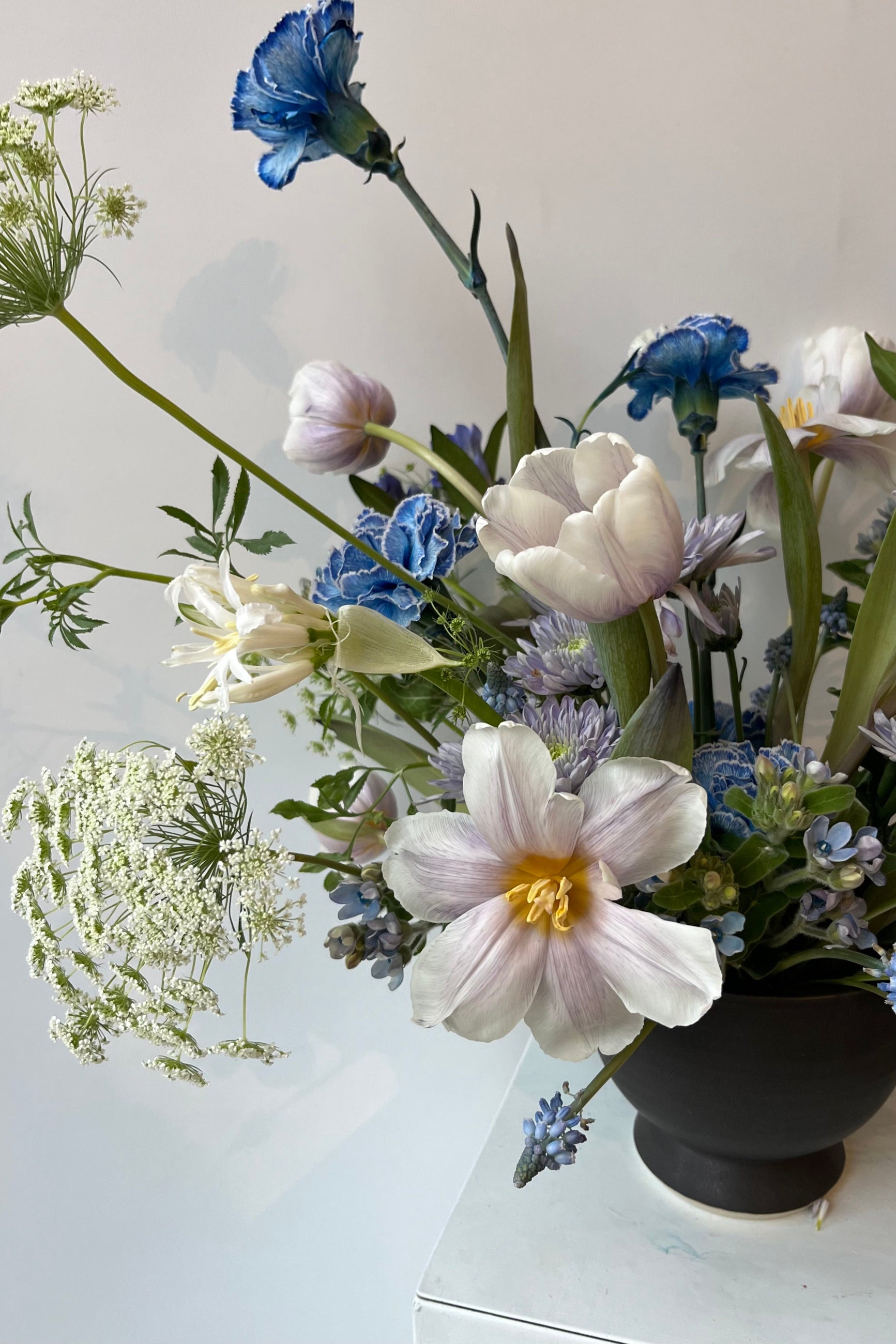 Sprout Home custom floral arrangement in shades of cream and blue with reflexed tulip ©Sprout Home #size_$200