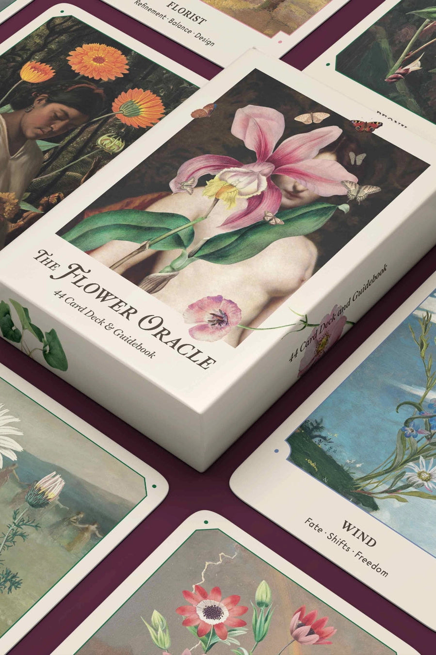 Flower Oracle card deck with cards spread out on a matching purple background ©Broccoli