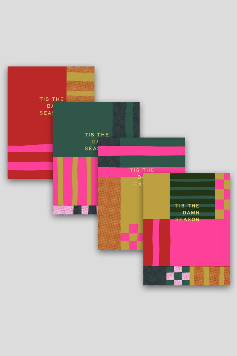 Four Holiday Season Patchwork Layers Card - Red greeting cards with colorful geometric patterns and the text 'TIS THE DAMN SEASON' arranged diagonally on a light gray background. Hammerpress