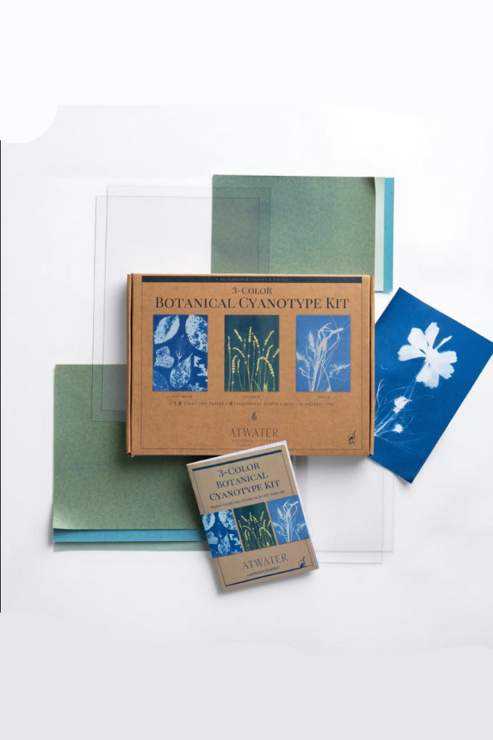 Botanical cyanotype kit with cyanotypes and packaging on a white background ©Schiffer Publishing