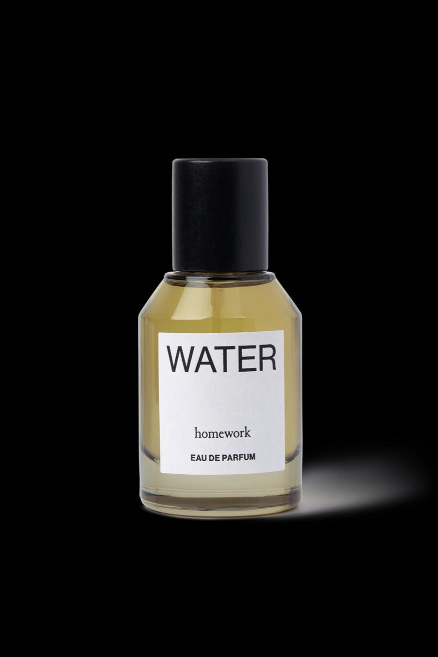 Water Eau de Parfum Perfume bottle labeled 'Water' by 'homework' on a black background ©Homework