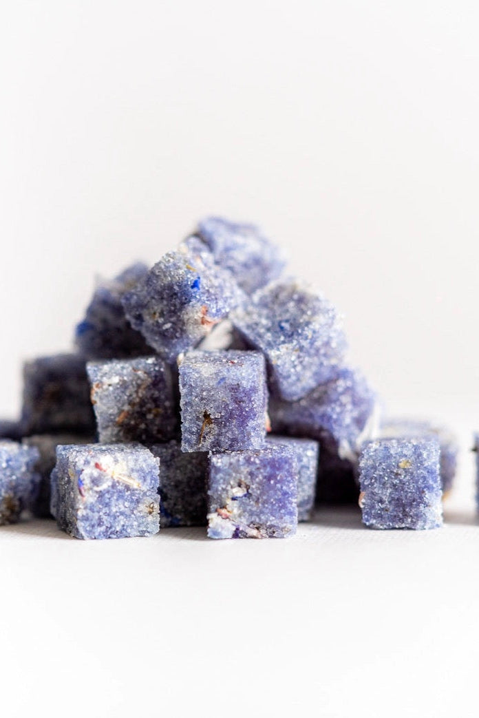 Stack of purple lavender sugar cubes on a white background ©Flouwer Co.