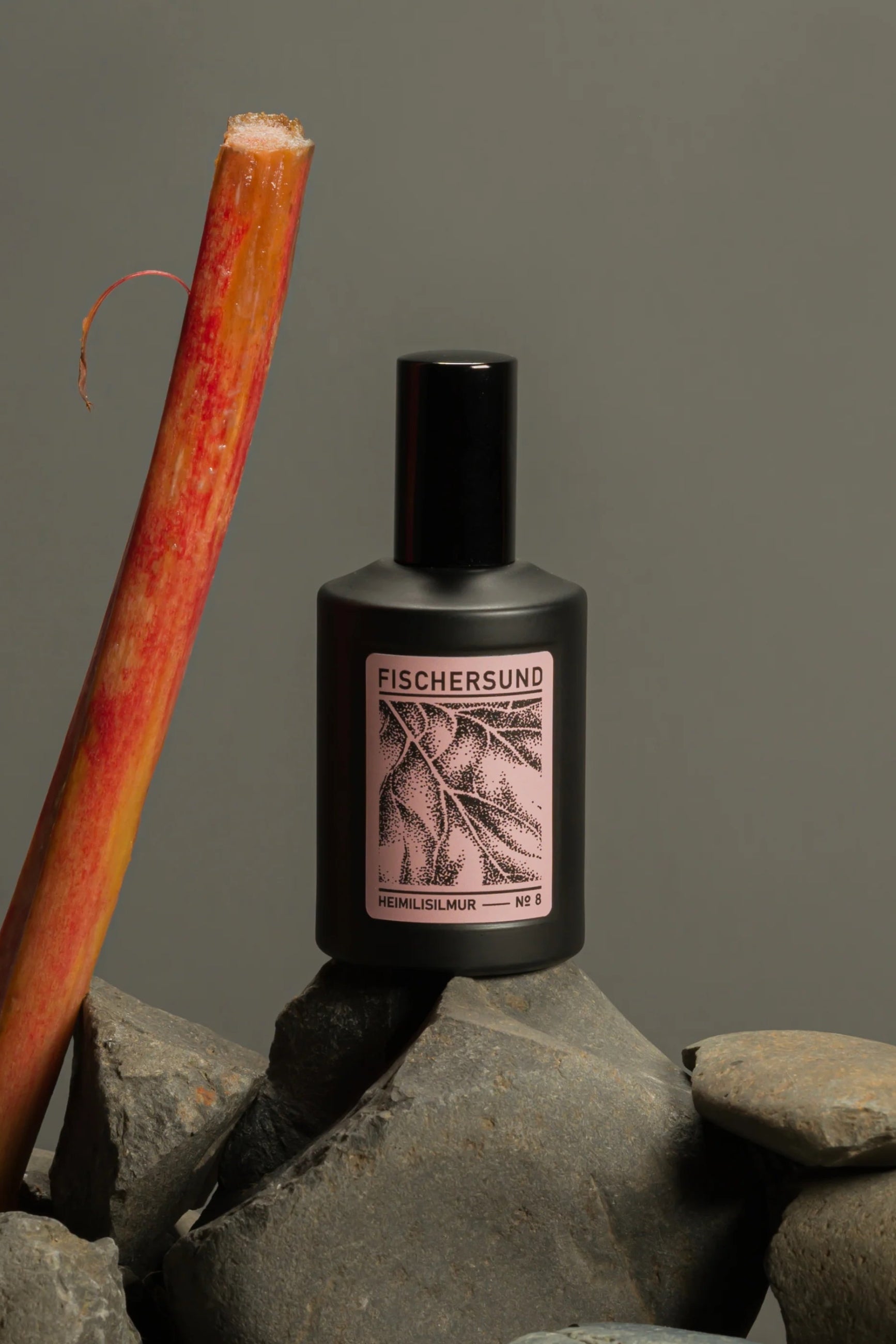 Fischersund Fischersund Home Spray #8 bottle with a rhubarb stalk on rocks against a gray background ©Fischersund