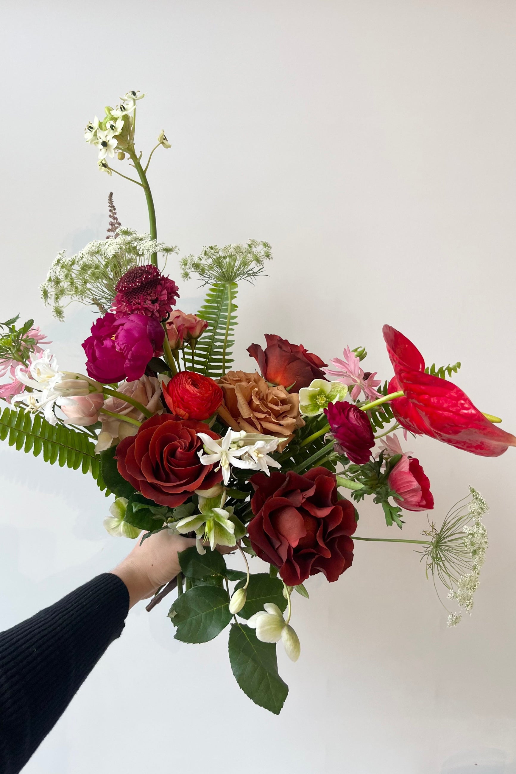 Custom FLoral arrangement by Sprout Home perfect for expressing love. Red Anthurium, roses and ranunculus ©Sprout Home #size_$130
