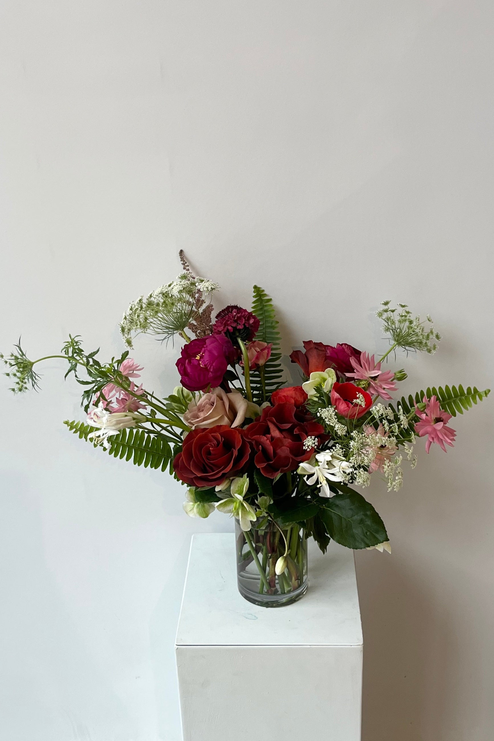 Custom Floral arrangement by Sprout Home perfect for Valentines day with red roses and ferns ©Sprout Home #size_$100