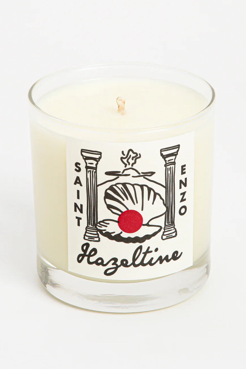 Candle in a glass jar with a label of Saint Enzo on a white background ©Hazeltine