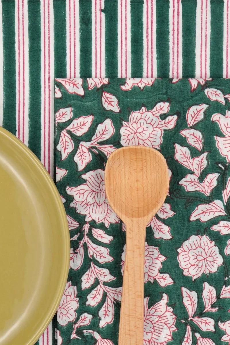 Cotton Napkins Iris Sapin shown with a matching plate and striped linen and spoon ©Suzette a Table