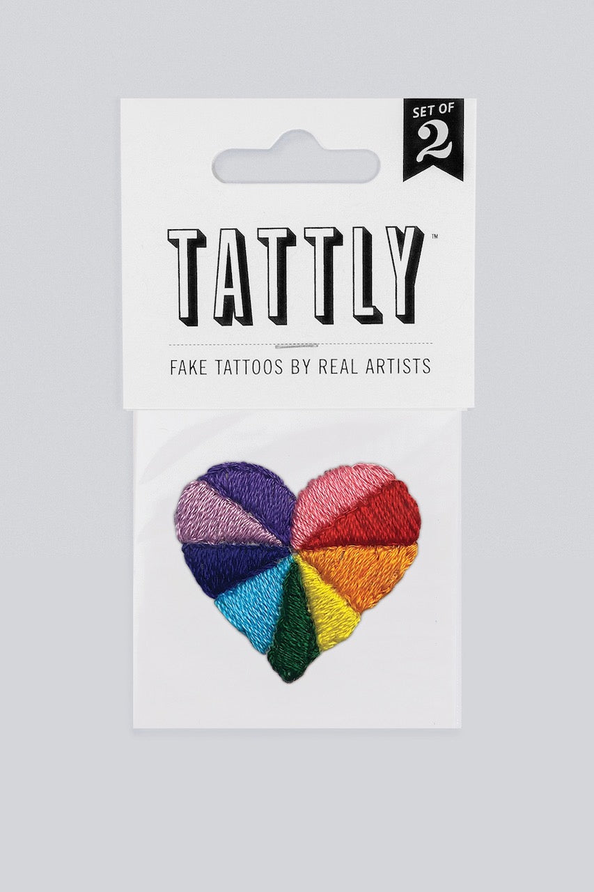 Tattly Rainbow Heart Tattoo Pair in its packaging.