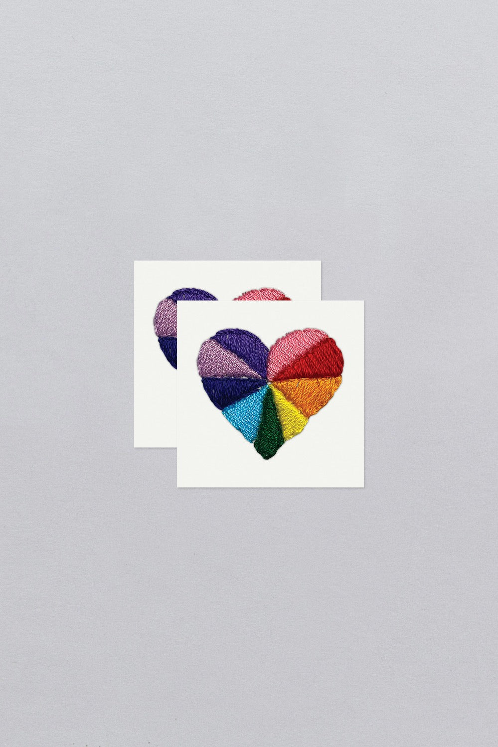 Rainbow Heart Tattoo Pair on their sheets from Tattly.