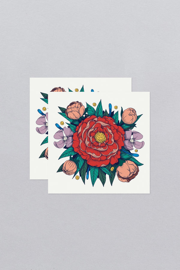 Tattly Red Peony Tattoo sheets one on top of another. 