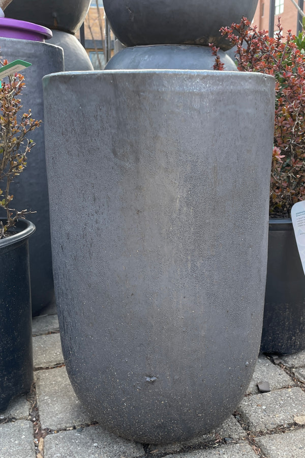 A graphite crucible planter, empty, and viewed from the side. 