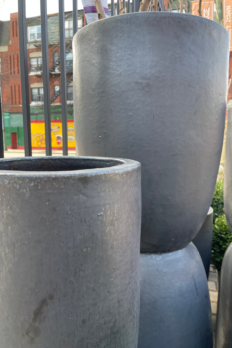 A group of empty Graphite Crucible planters at Sprout Home. 