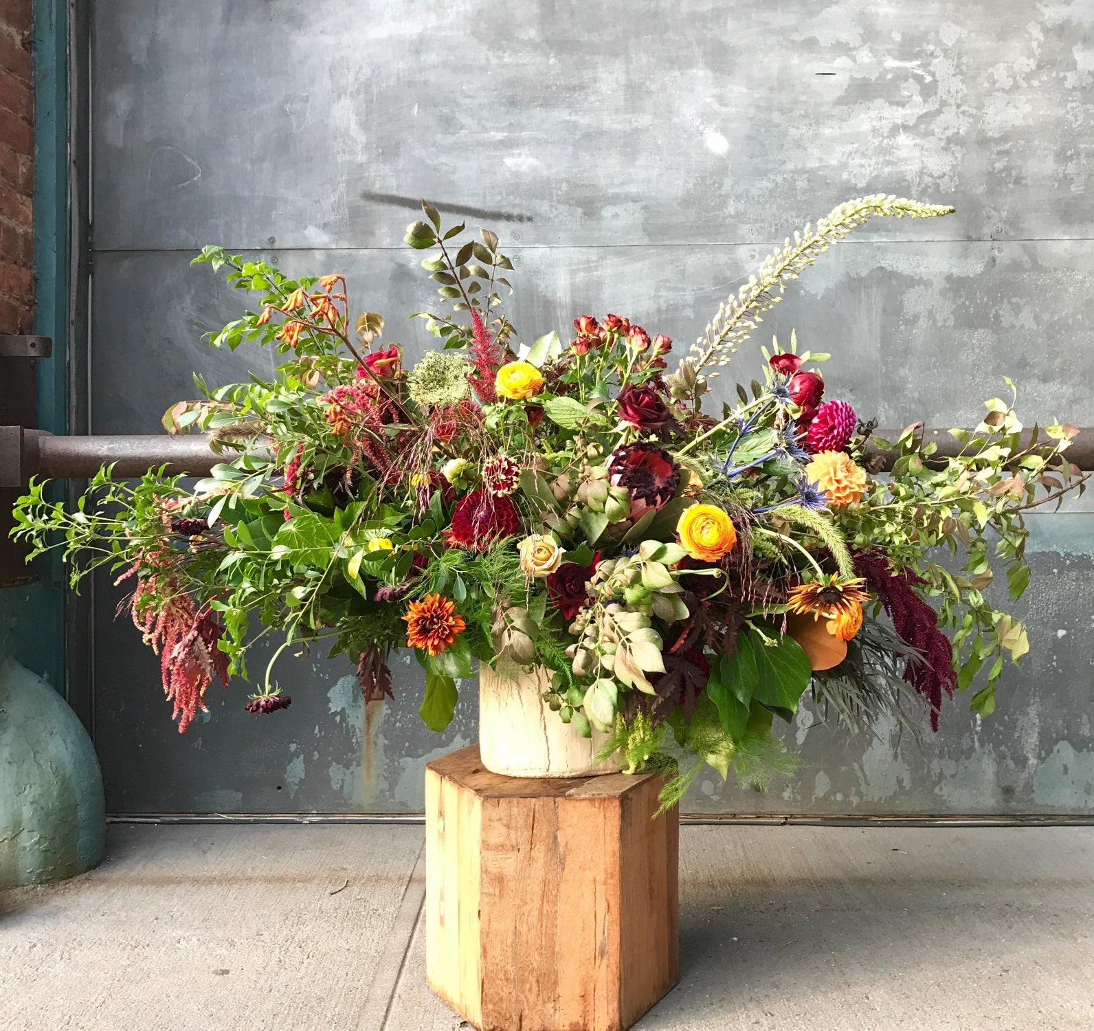 A fall wild arrangement full of texture and greens. Floral by Sprout Home. Photo by Sprout Home.