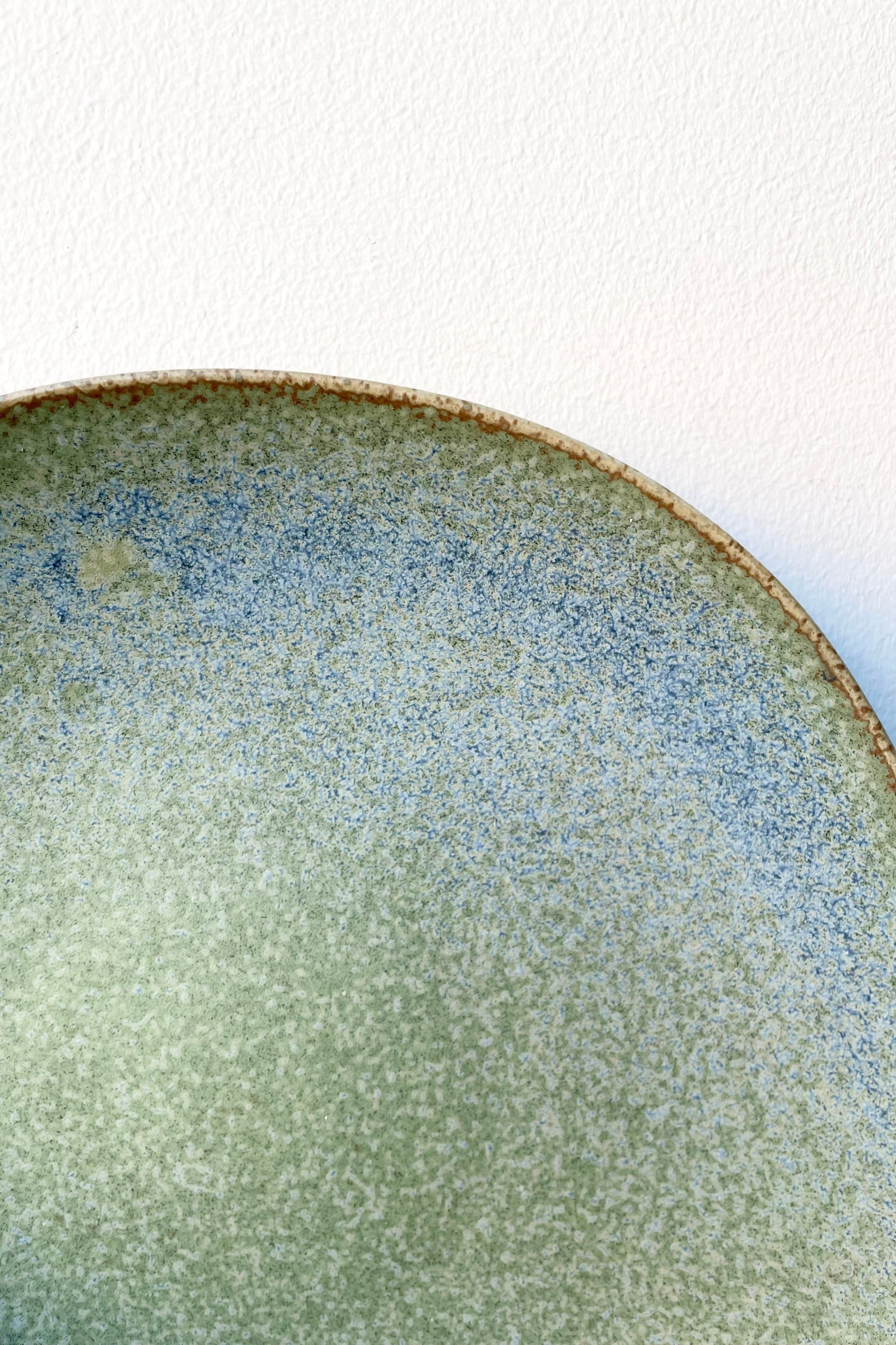 The Shiho plate in terra green showing the detail of the color up close. ©Sprout Home