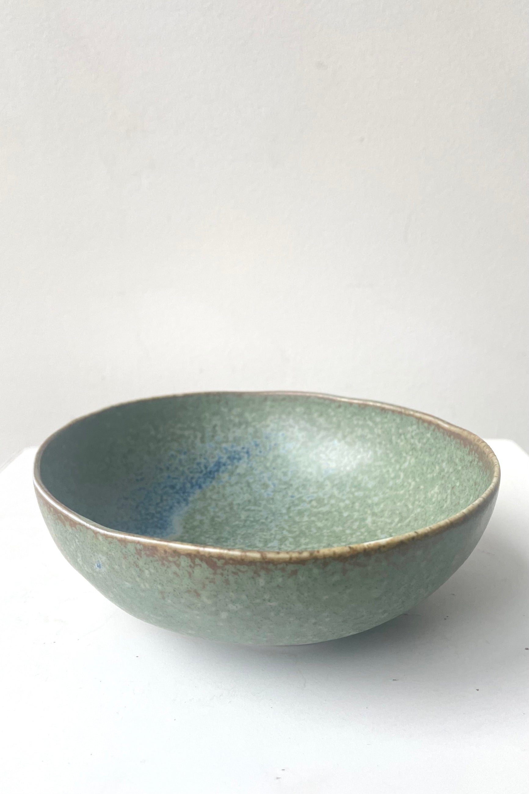 A frontal view of Bowl terra green small against white backdrop ©Sprout Home