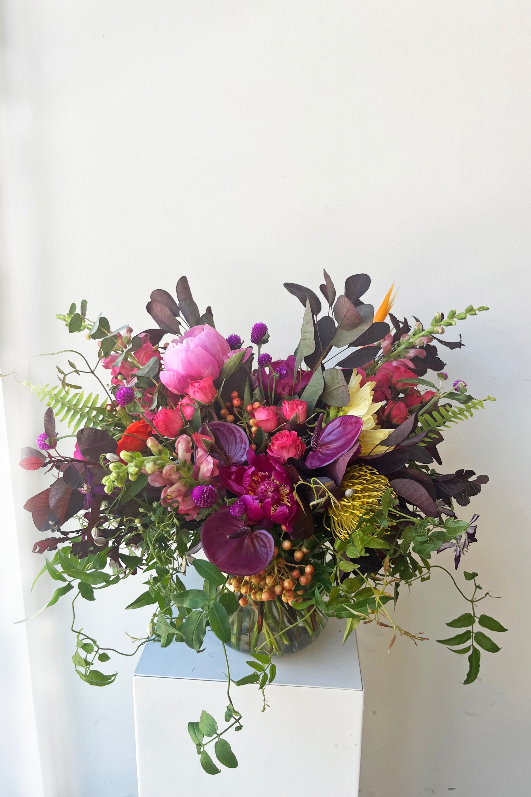 An example of fresh Floral Arrangement Storm with purple anthurium, peonies and fuchsia roses from Sprout Home Floral in Chicago ©Sprout Home #size_$200