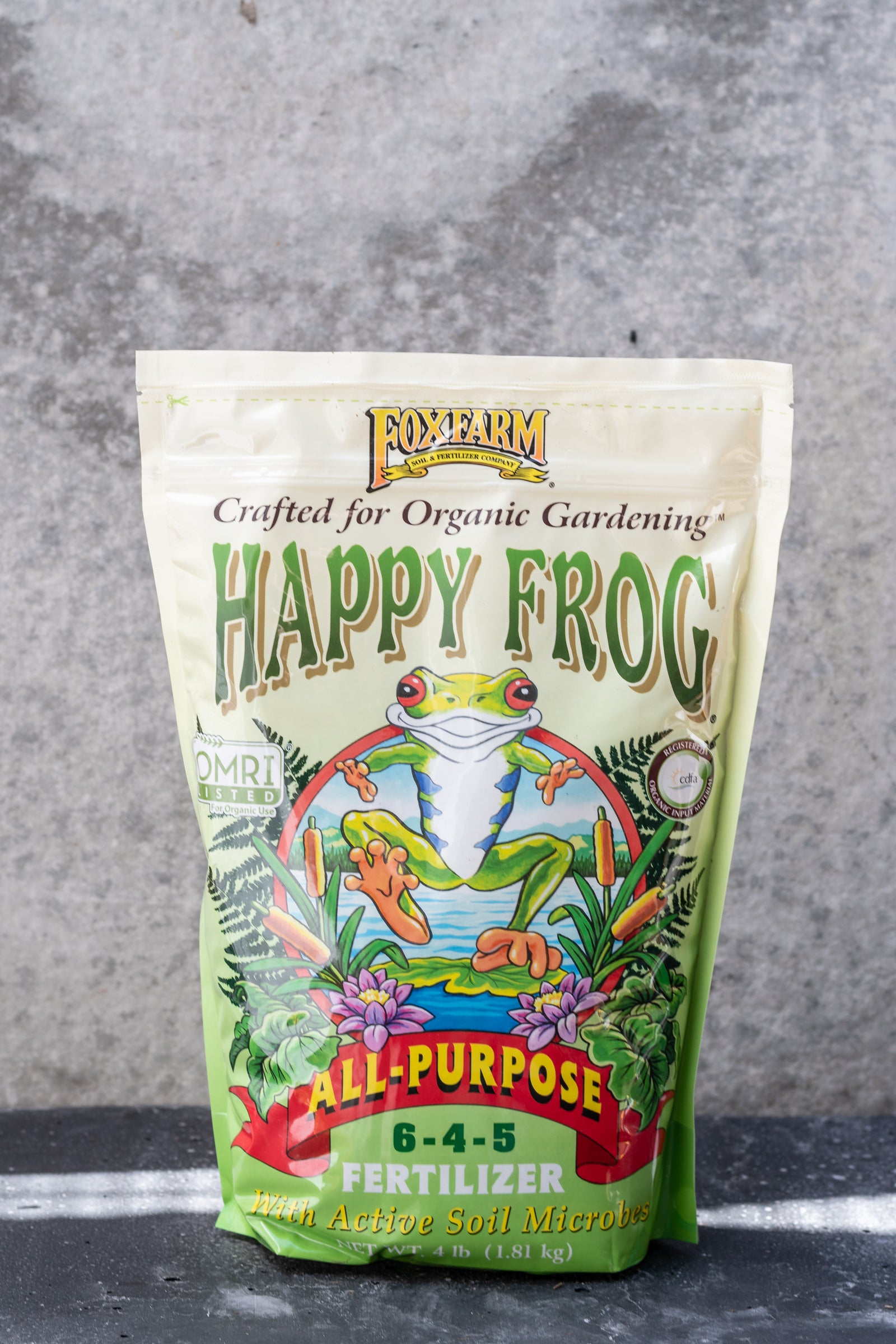 Happy Fog All purpose fertilizer by Fox Farm in its bag with a frog image on it.