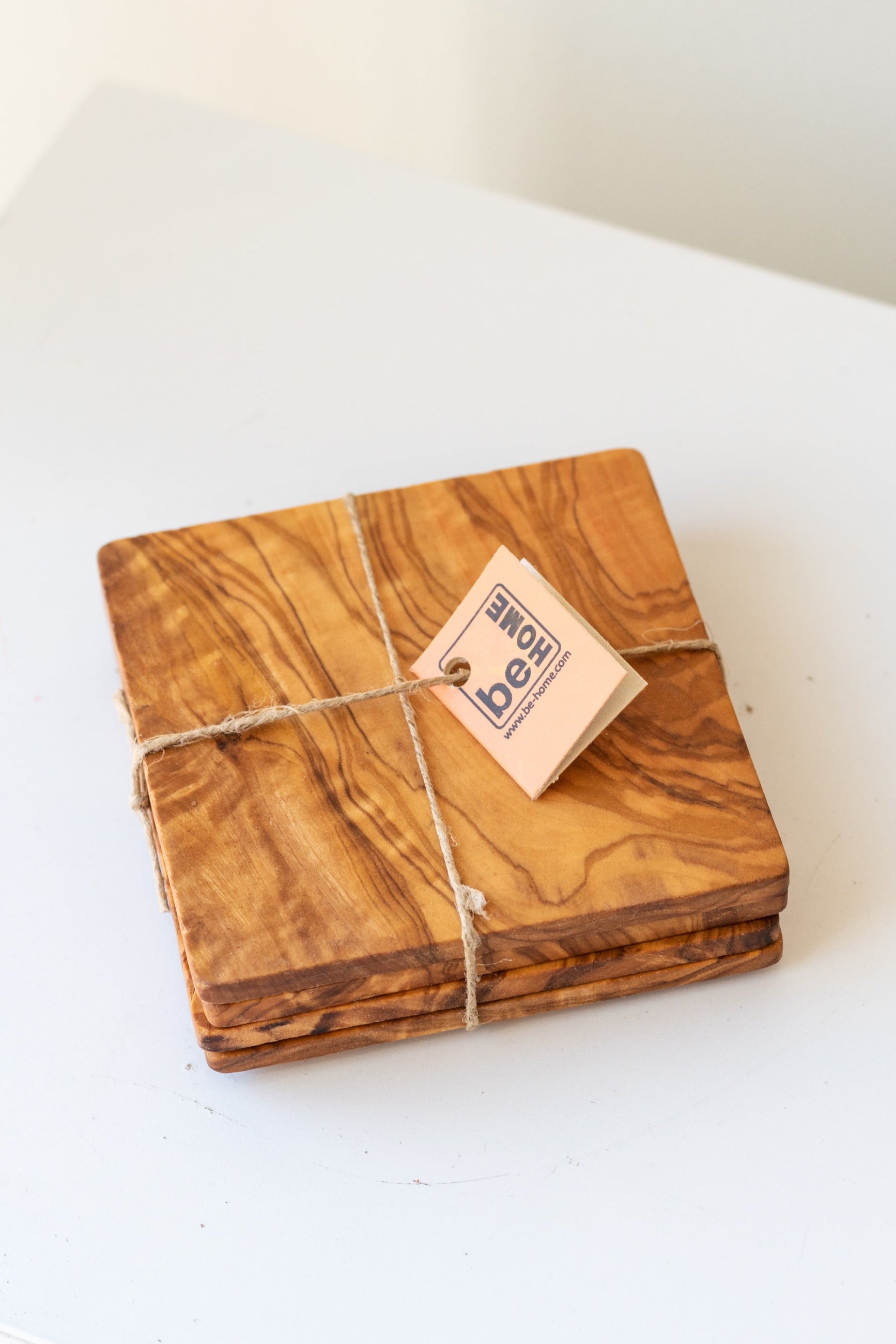 Olive wood coaster set tied together ©Sprout Home