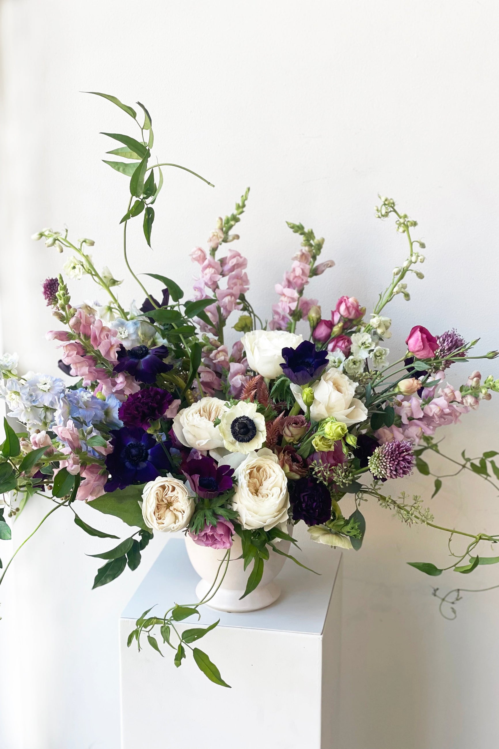 An example of fresh Floral Arrangement Storm for with white garden roses and deep purple anemone from Sprout Home Floral ©Sprout Home #size_$200