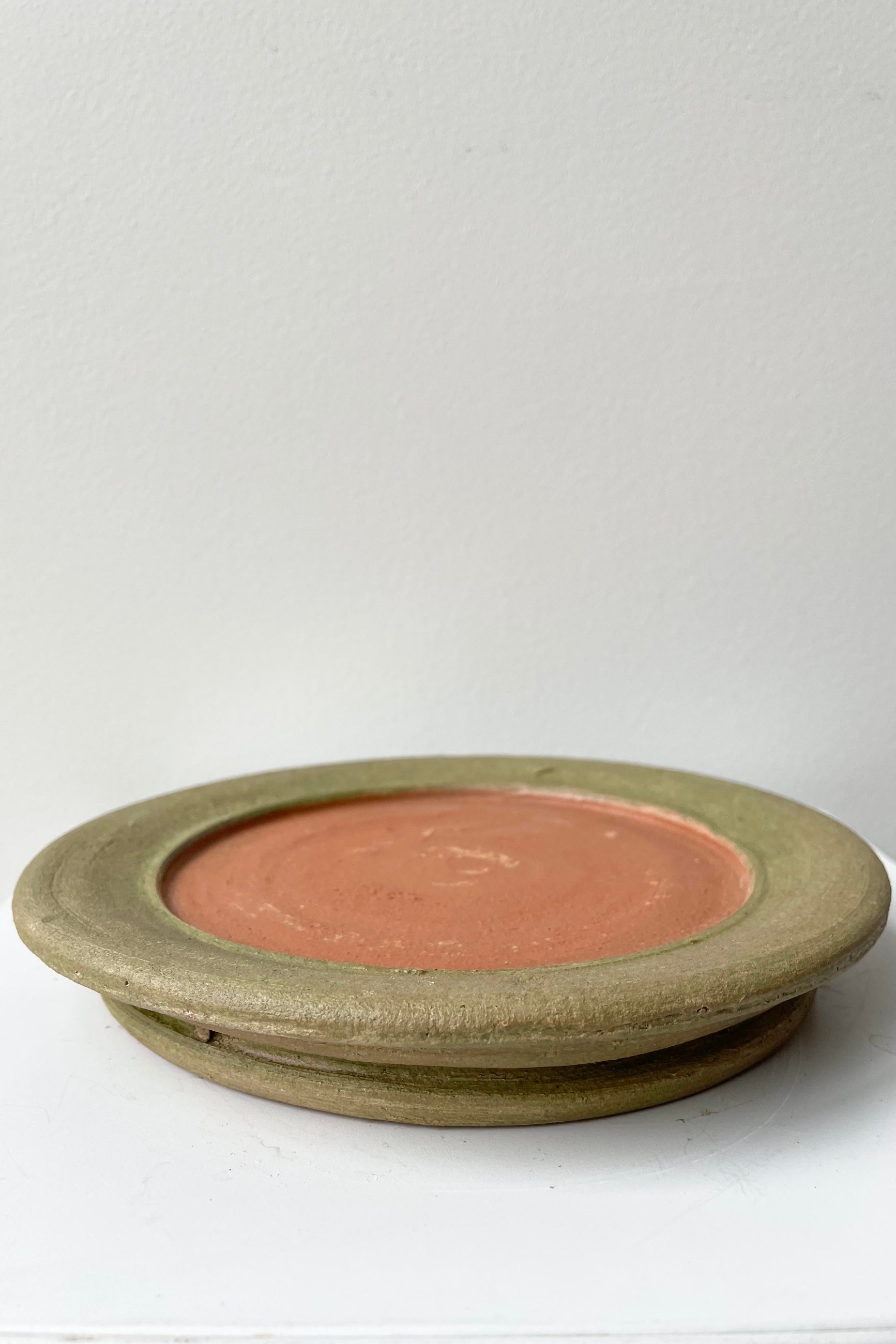 The Aged Saucer #2 lays flat against a white backdrop. ©Sprout Home