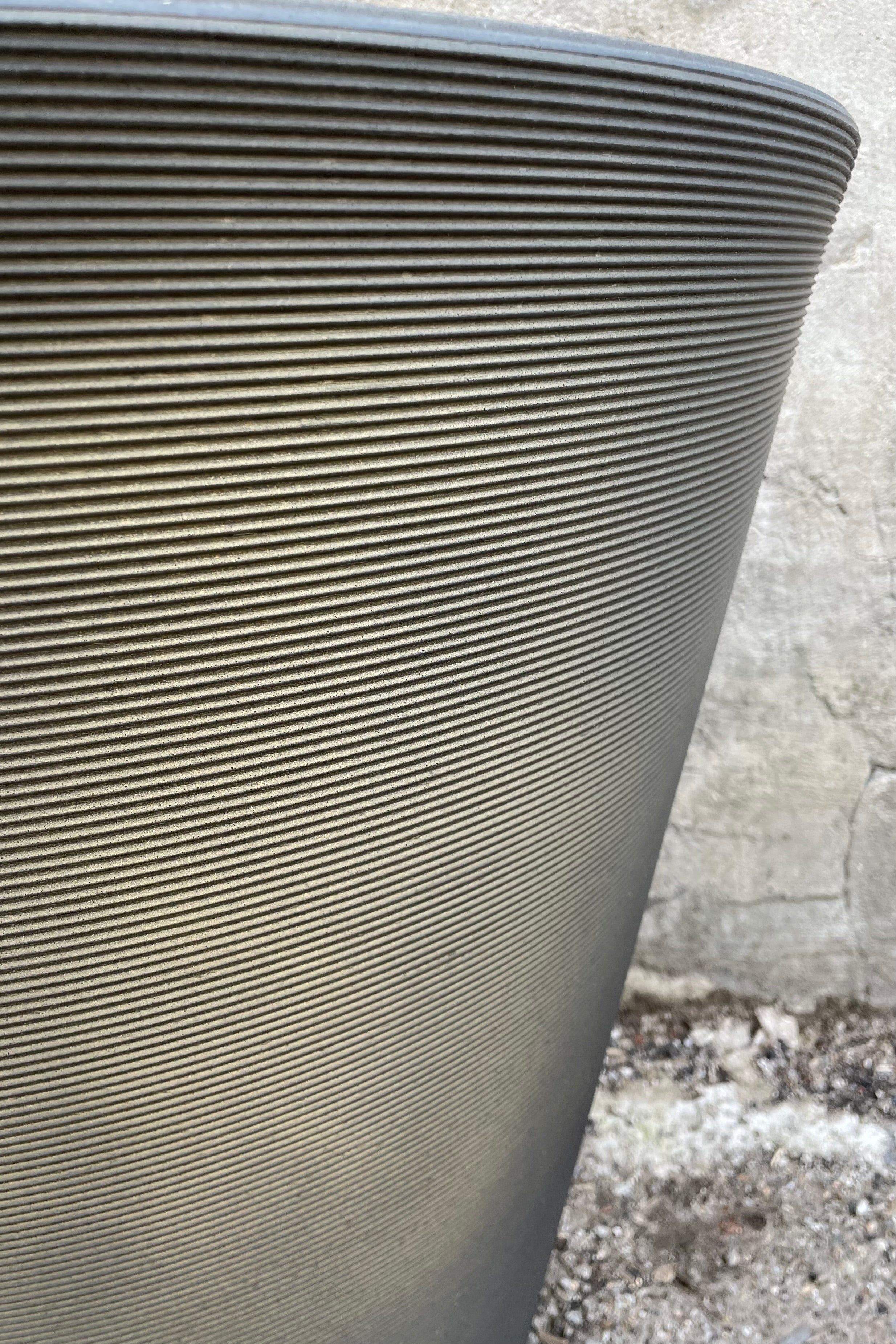 a detail shot of the horizontal banding on the old bronze Madison pot.