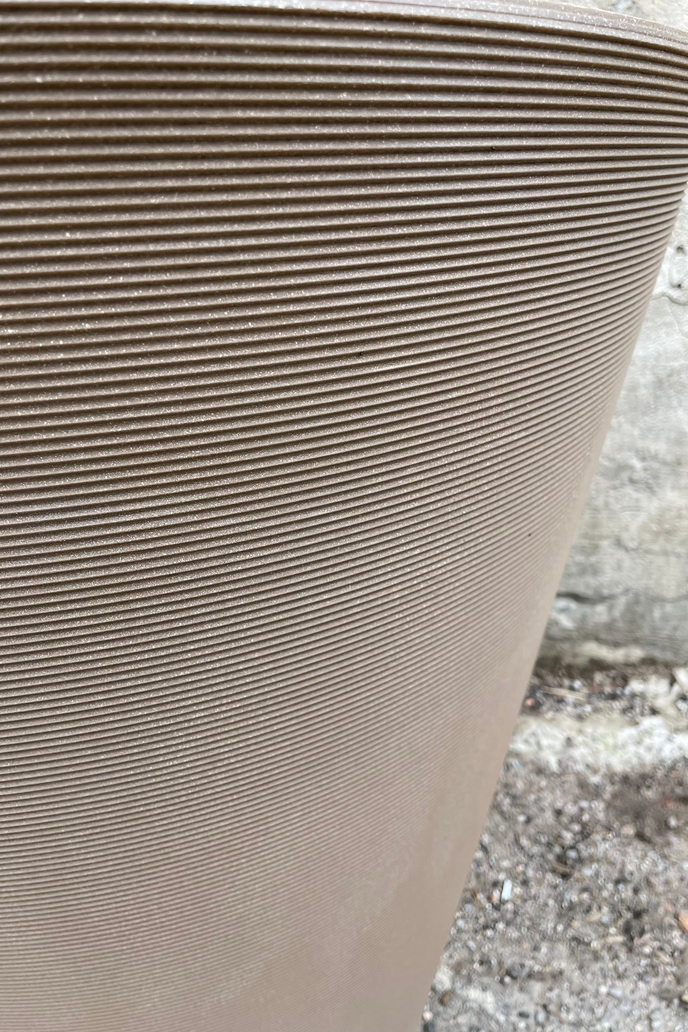 detail picture of the horizontal ridges of the the mocha colored Madison pot.