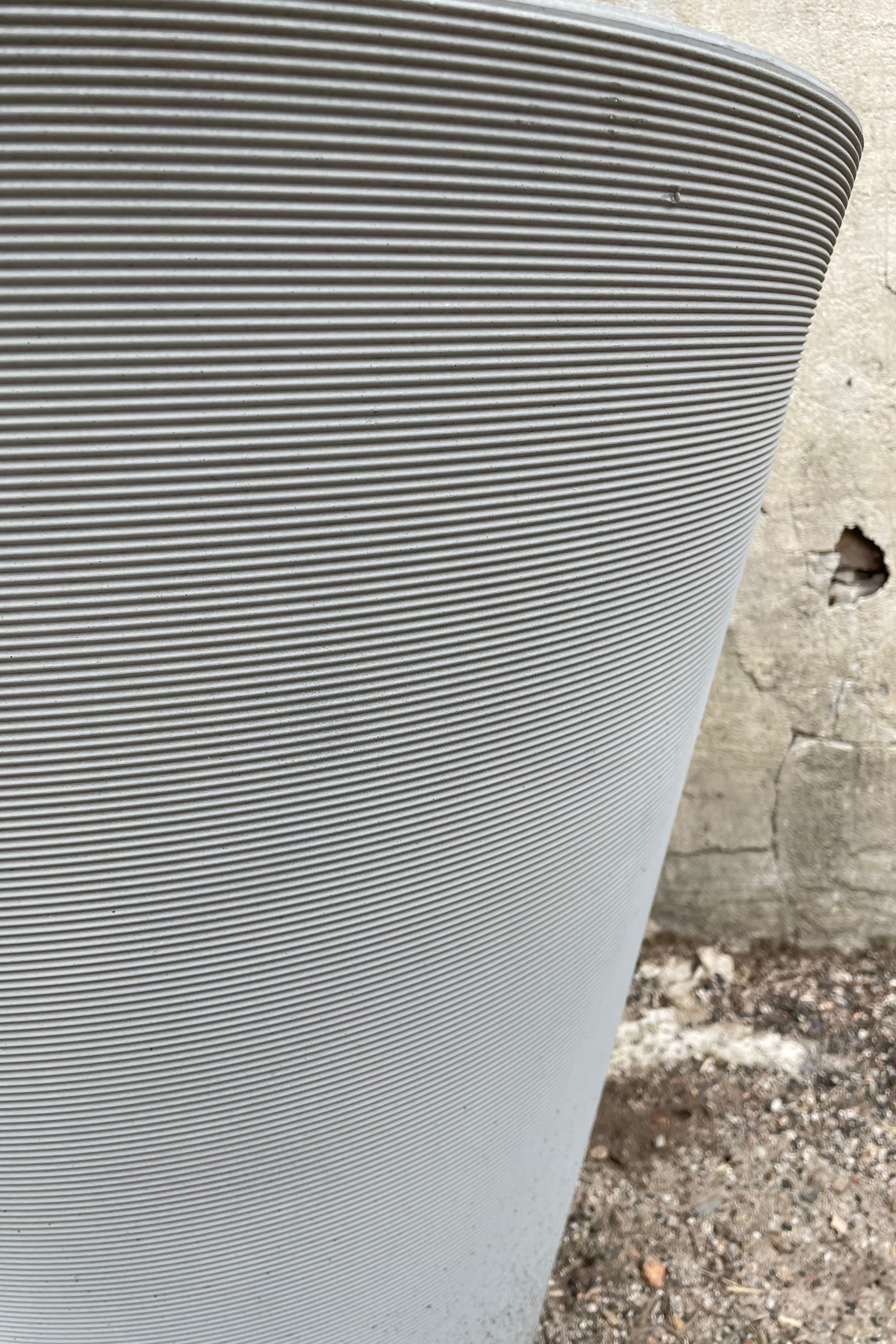detail picture of the horizontal ridges of the weathered greystone Madison planter.