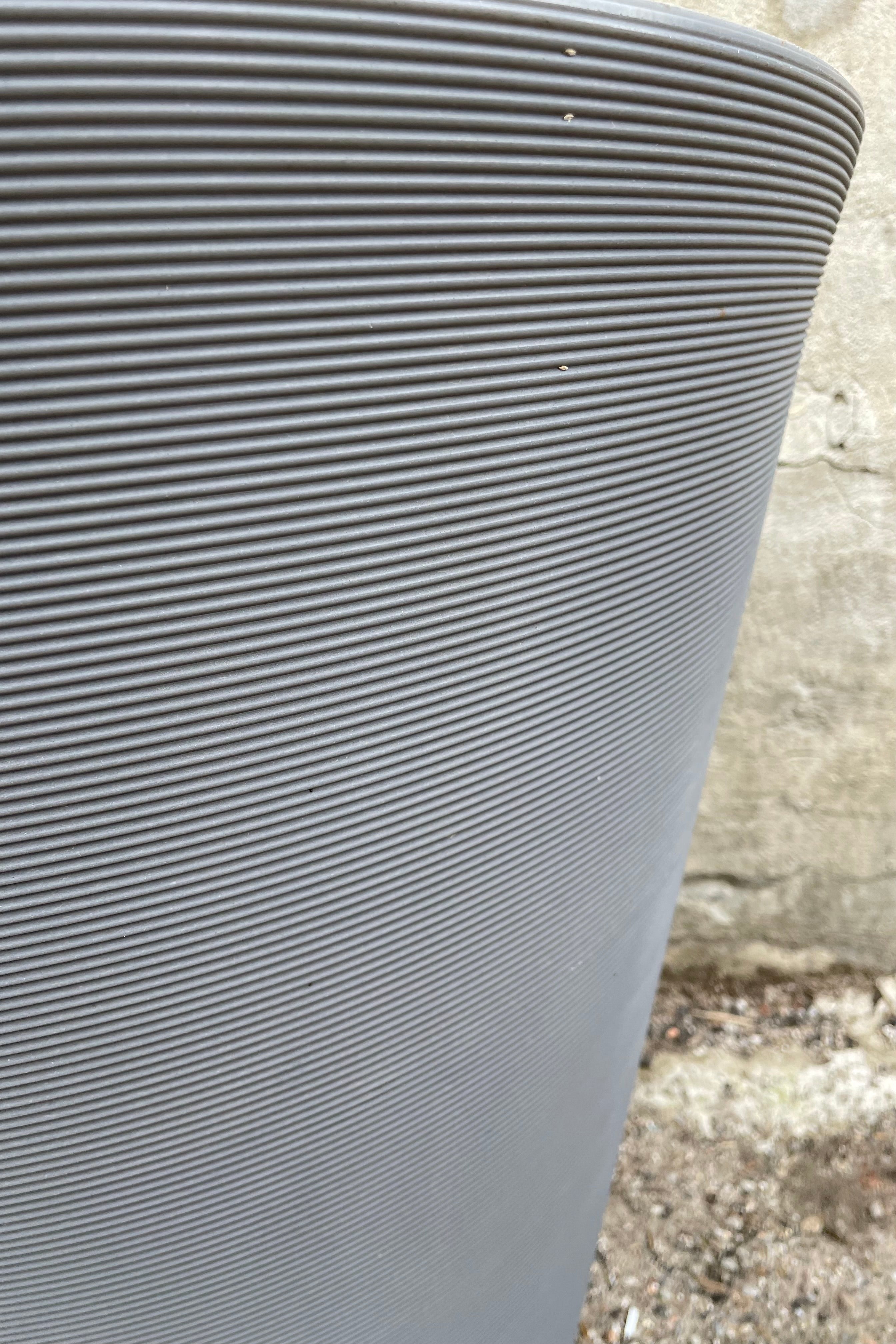 A detail picture of the horizontal ridging of the slate madison planter.