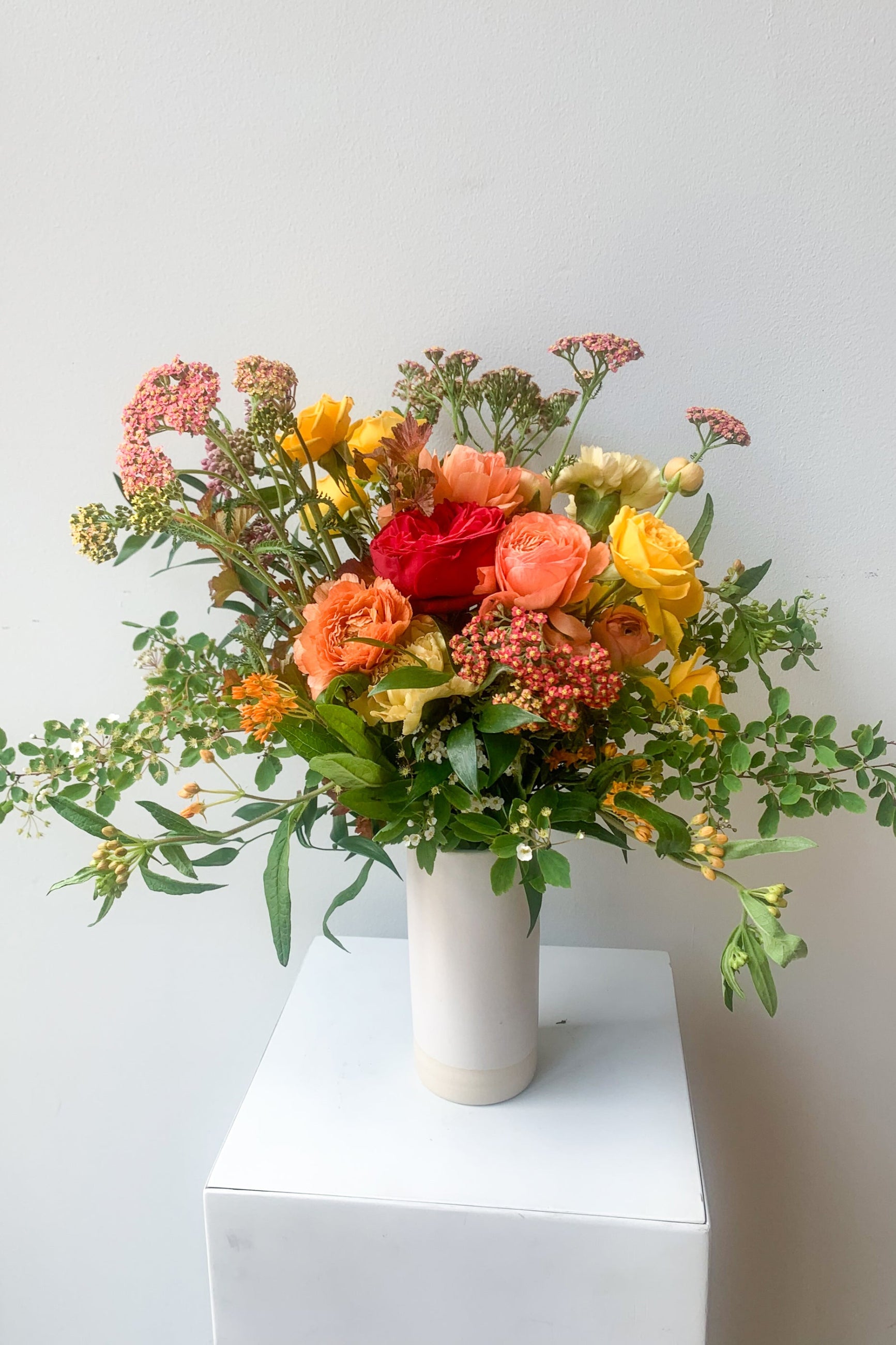 Custom floral arrangement by Sprout Home featuring achillea and warm tones ©Sprout Home #size_$100