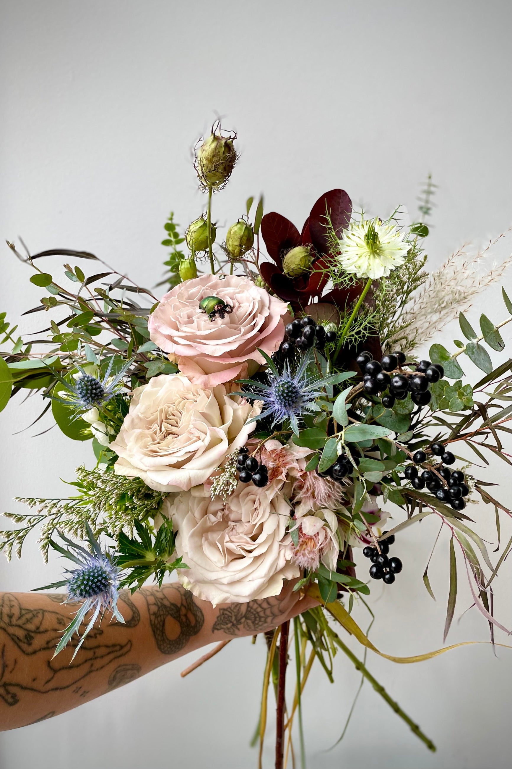 Halloween Holiday floral arrangement 'Betelgeuse' by Sprout Home complete with a green Beatle. ©Sprout Home #size_$130