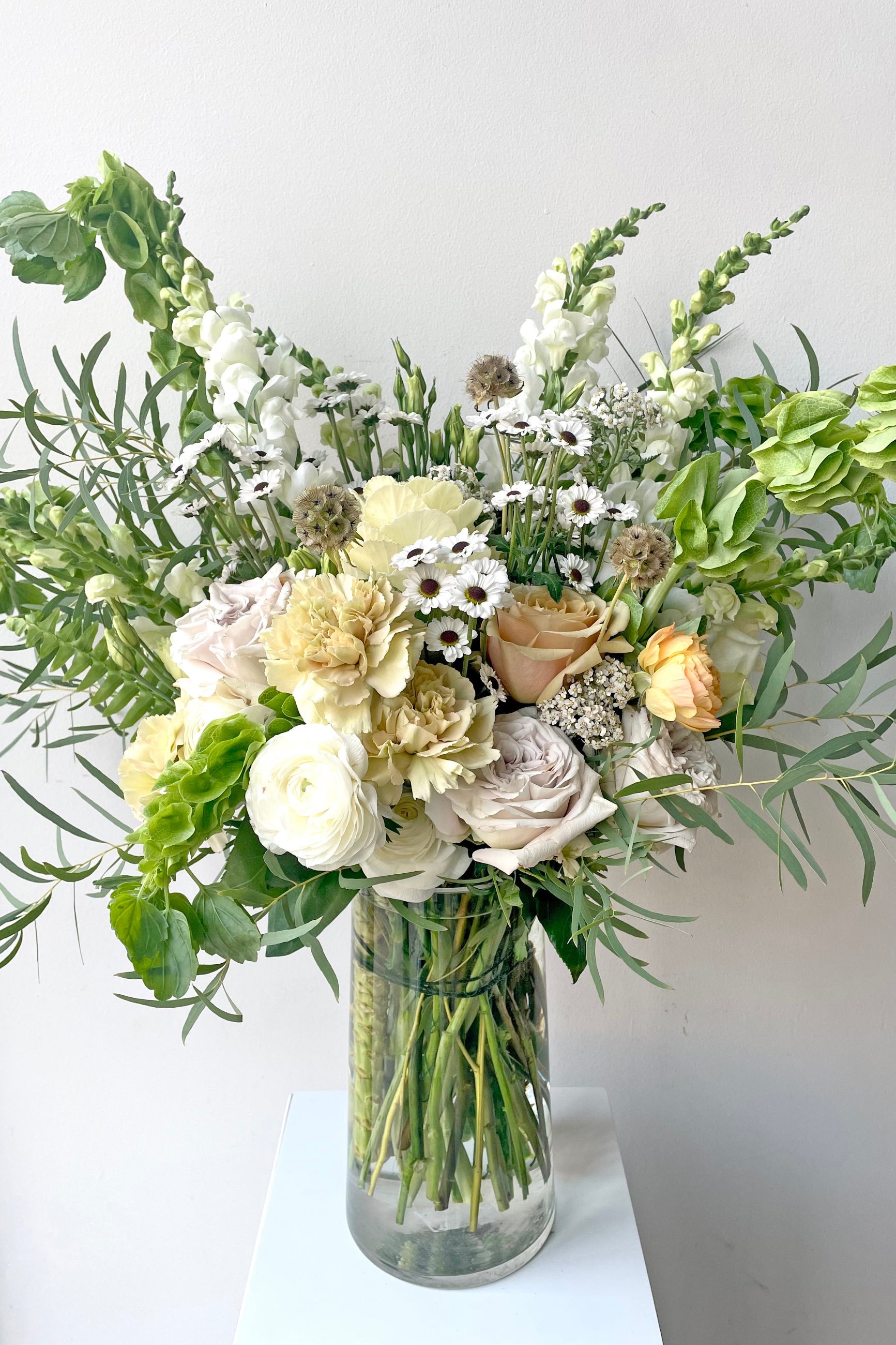 An example of Fresh Floral Arrangement Bleached with white daisies, roses and bells of Ireland from Sprout Home Floral in Chicago ©Sprout Home #size_$200