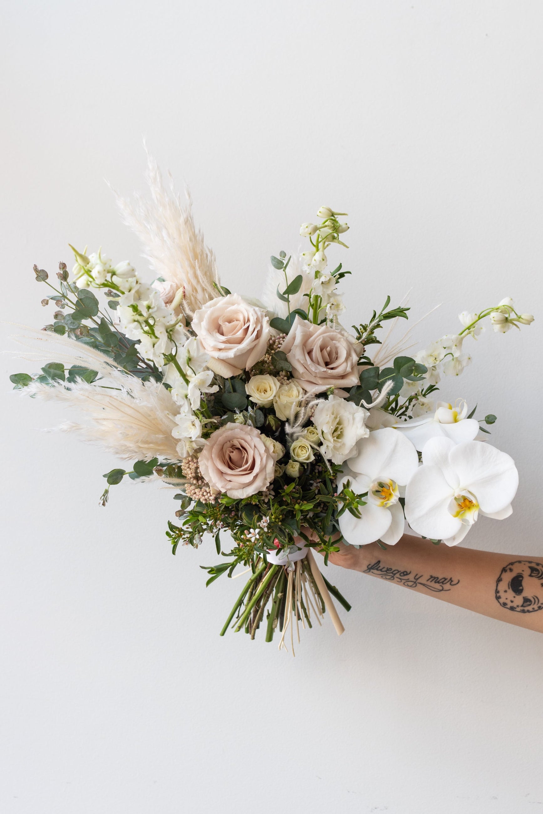 An example of Floral Arrangement Bleached by Sprout Home in Chicago. The arrangement uses primarily white flowers with green foliage. ©Sprout Home #size_$160