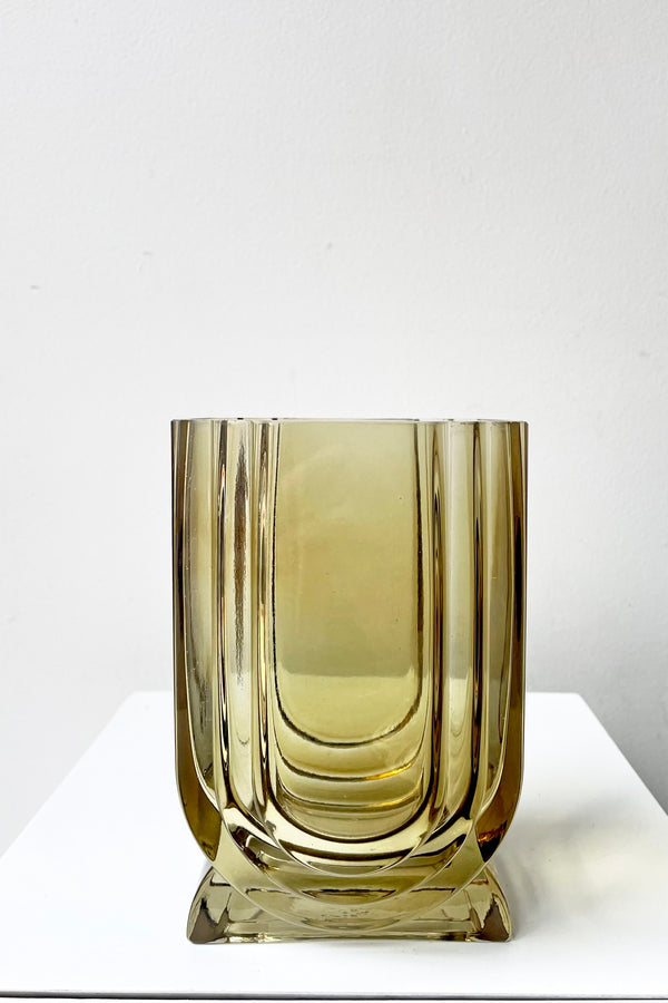 A frontal view of the Deco Glass Vase in amber against a white backdrop