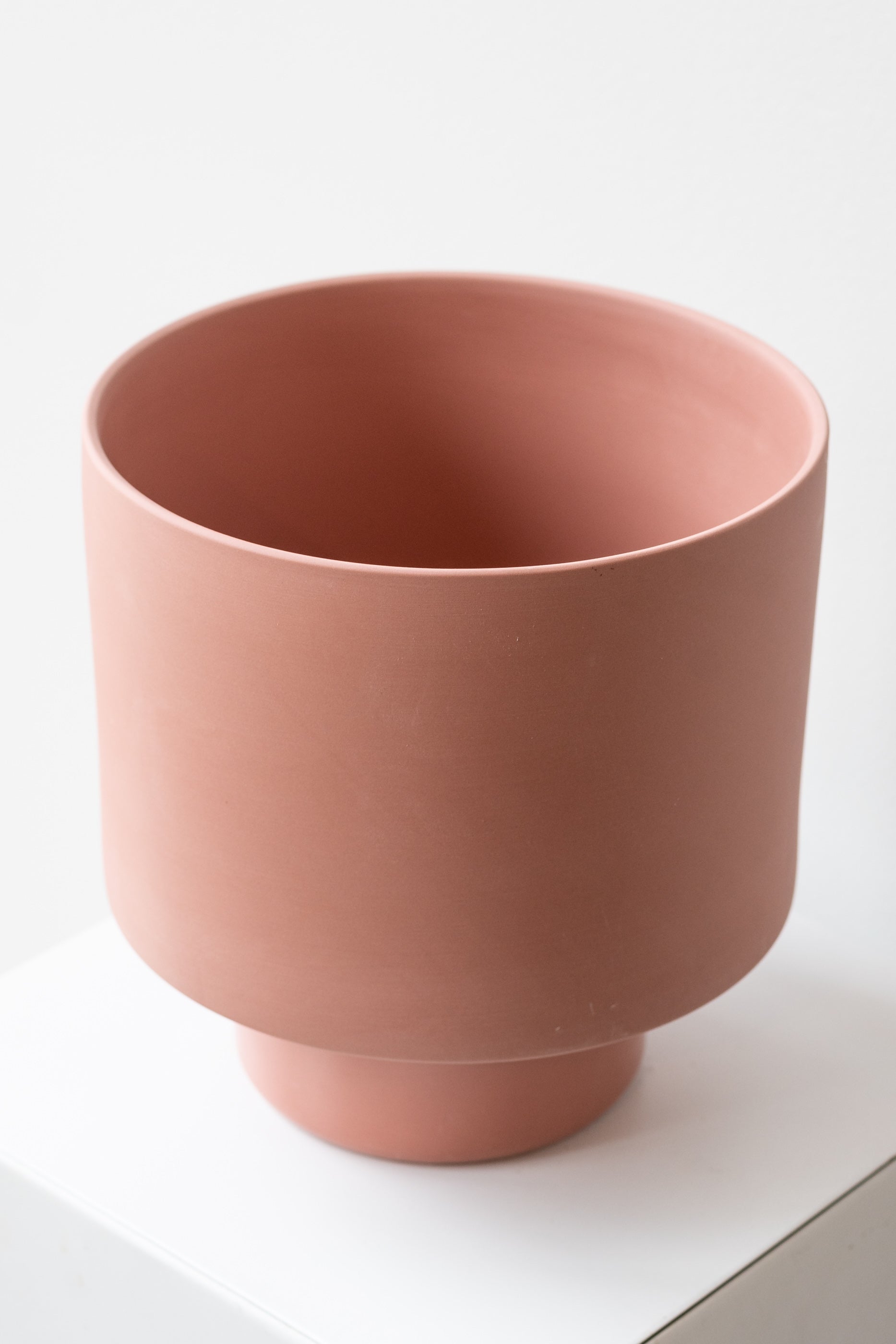 Angus & Celeste Collector's Gro pot ochre x-large on white surface in front of white background