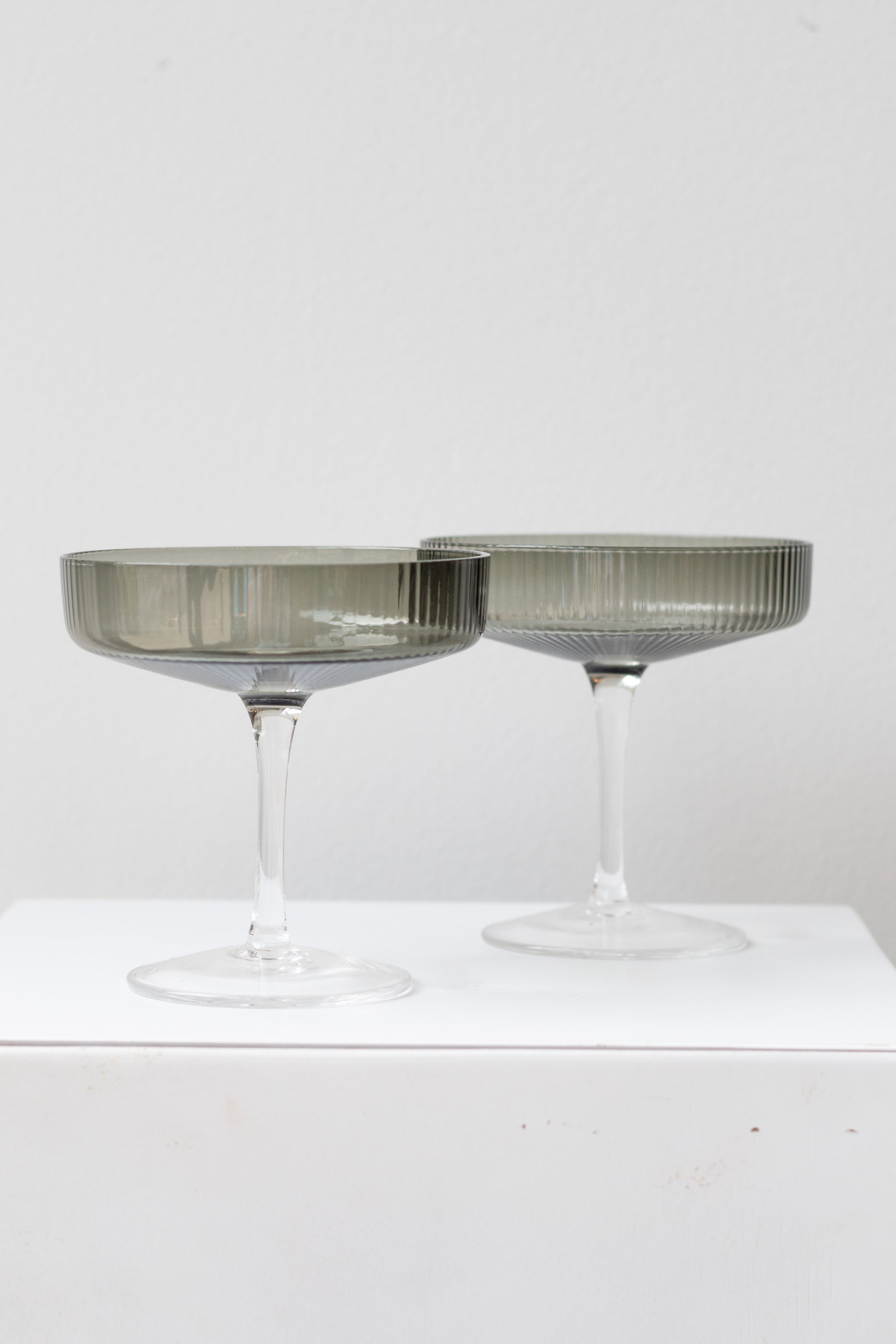 Ferm Living Ripple Champagne Saucers Set of 2 glass smoke on a white surface in a white room