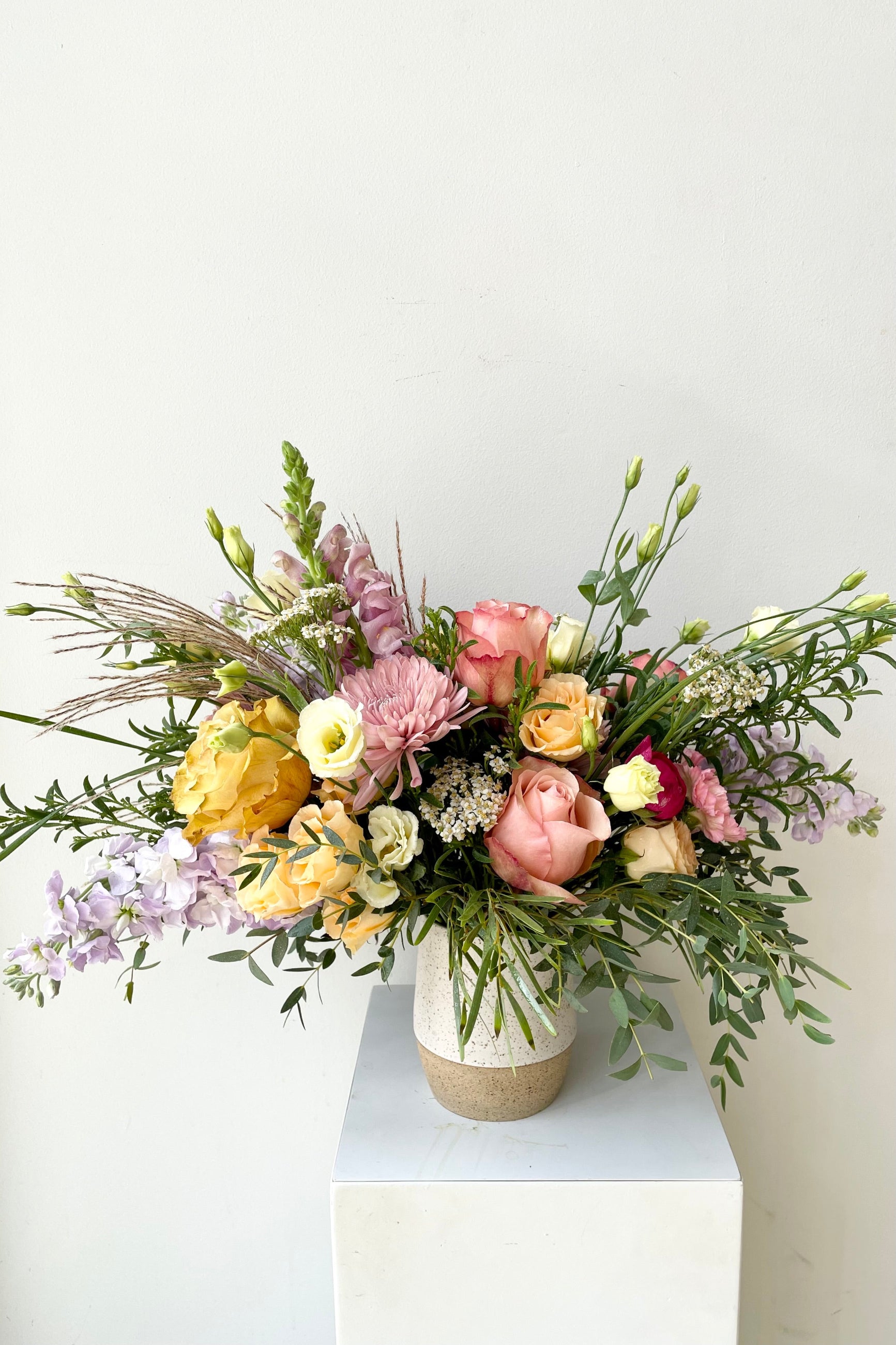 A fun and flirty custom floral arrangement by Sprout Home in shades of pinks and ochre ©Sprout Home #size_$130