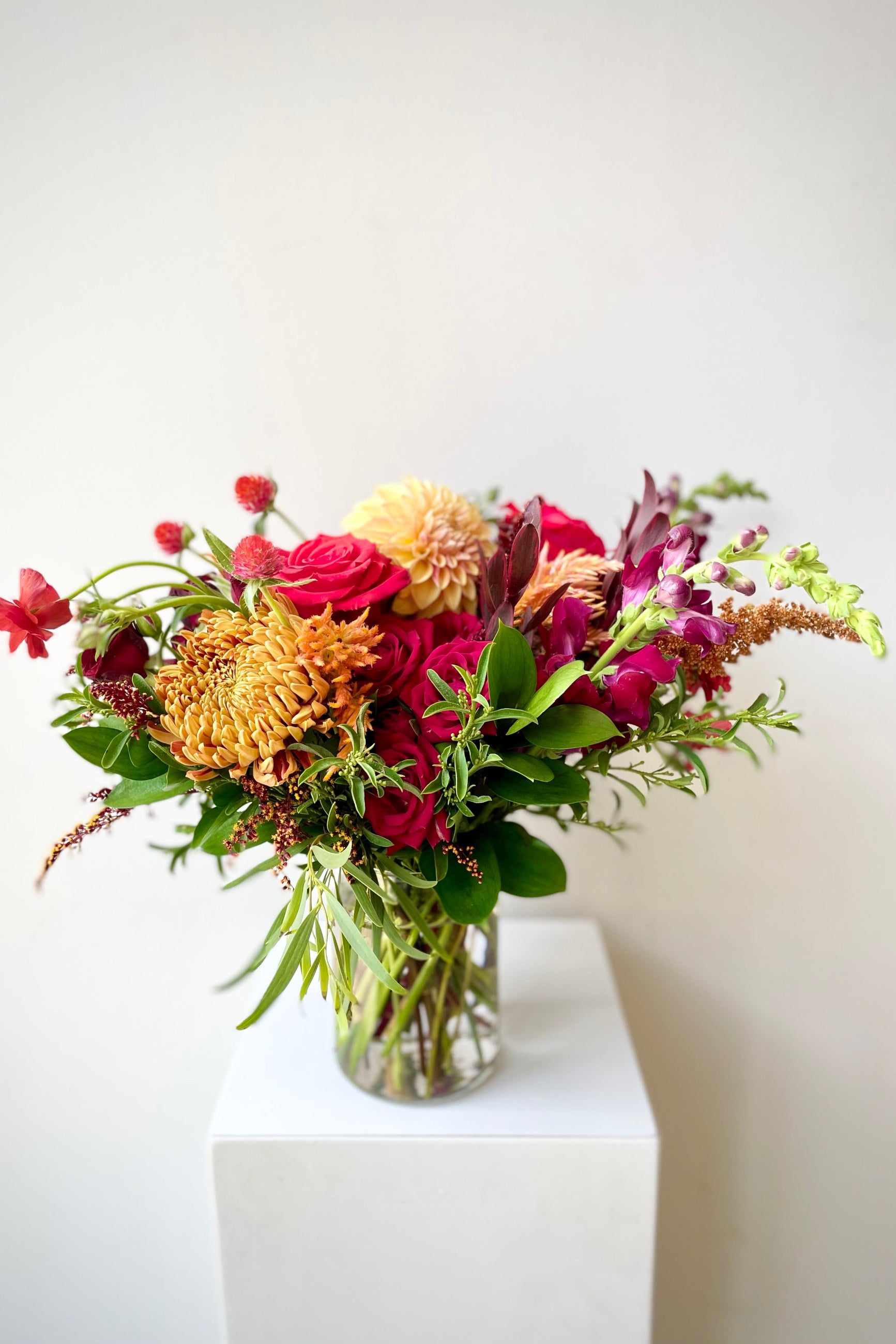 A custom arrangement by Sprout Home featuring mums and roses ©Sprout Home #size_$100