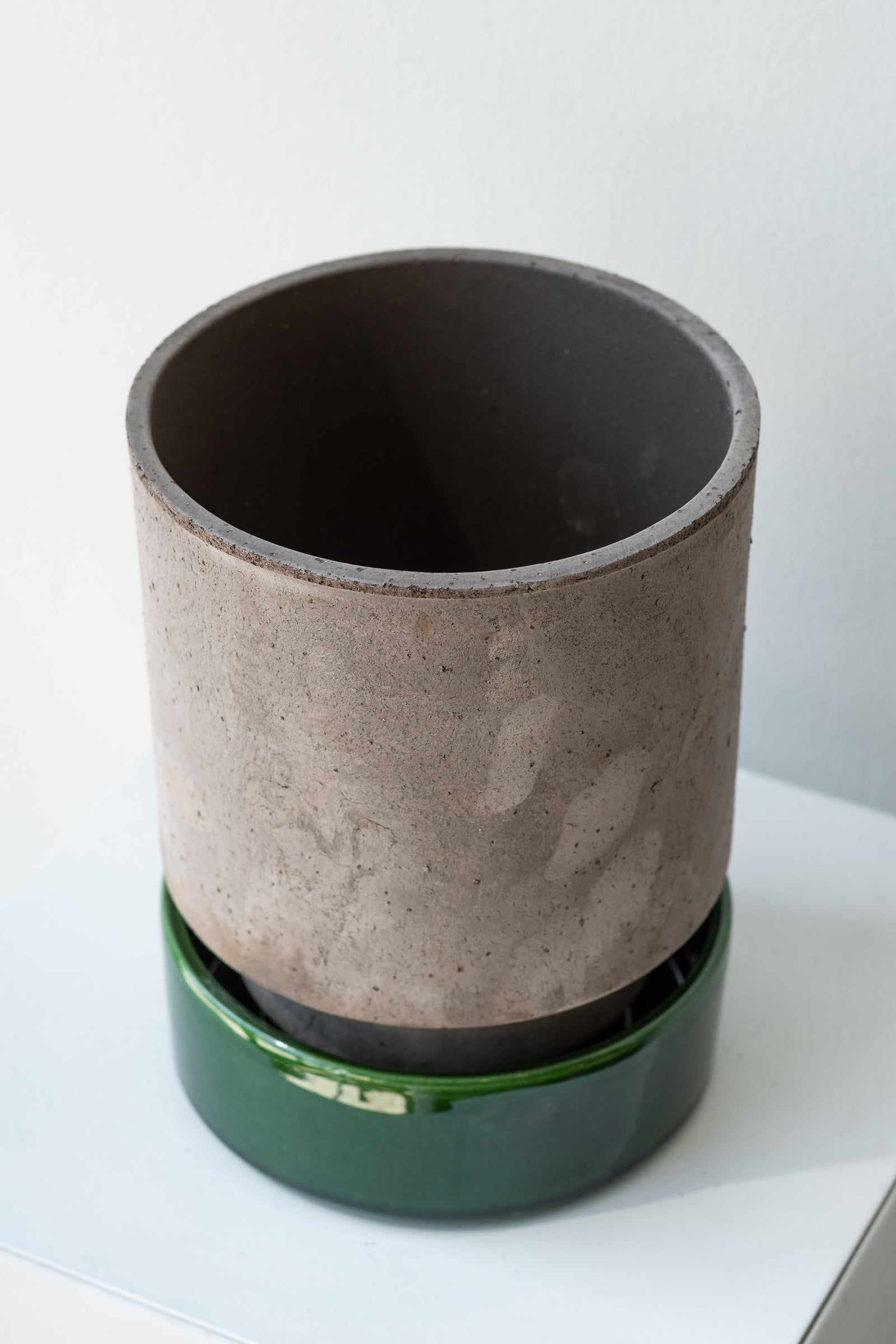 Grey and emerald 5.5 inch Hoff Pot by Bergs Potter on a white surface in a white room