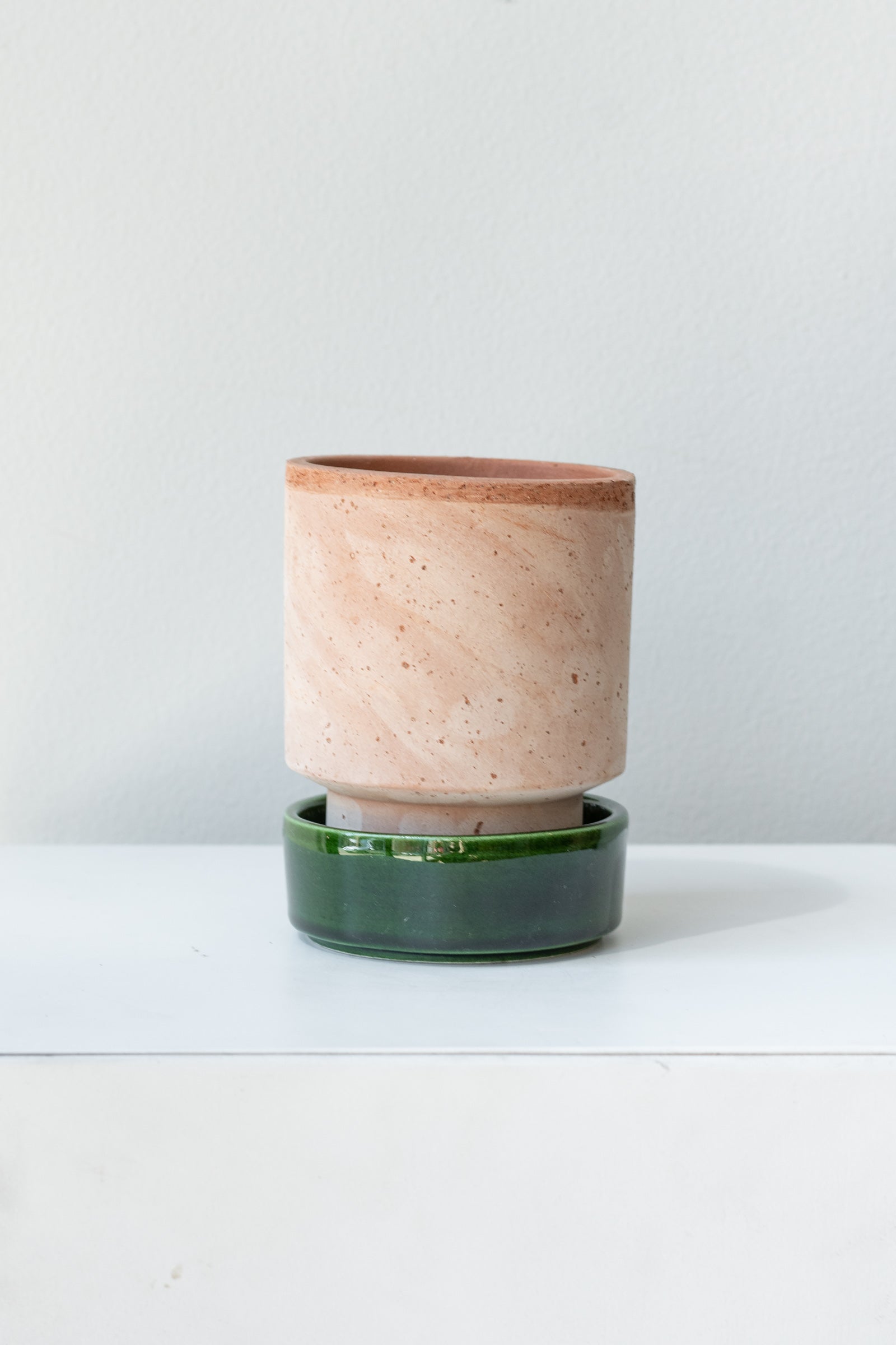 Rosa and emerald 3.1 inch Hoff Pot by Bergs Potter on a white surface in a white room